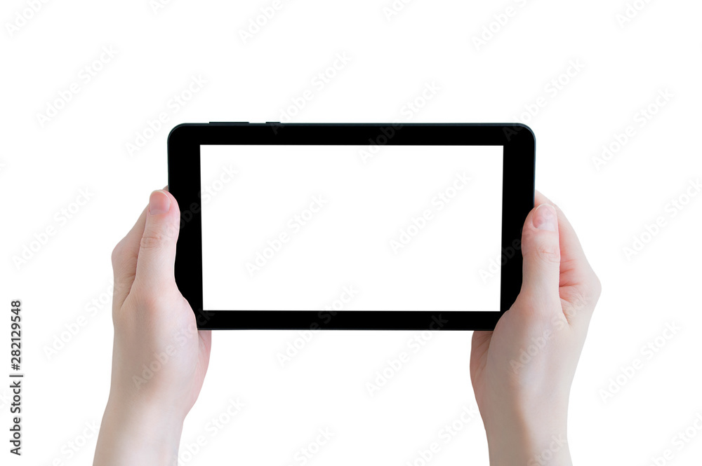 Black tablet with a white display in the hands of a caucasian girl. Isolate Close-up. Black tablet with a white display in the hands of a caucasian girl. Isolate Close-up.
