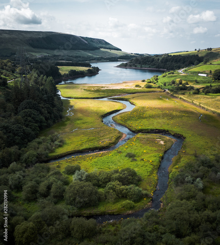 Stunning Peak District National Park Aerial shot at the Woodhead to Torside reservoirs showing the streams of water connecting the two