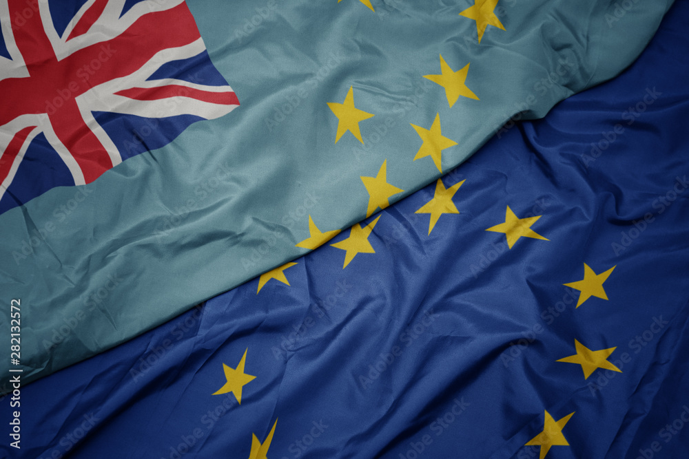 waving colorful flag of european union and flag of Tuvalu. waving colorful flag of european union and flag of Tuvalu.
