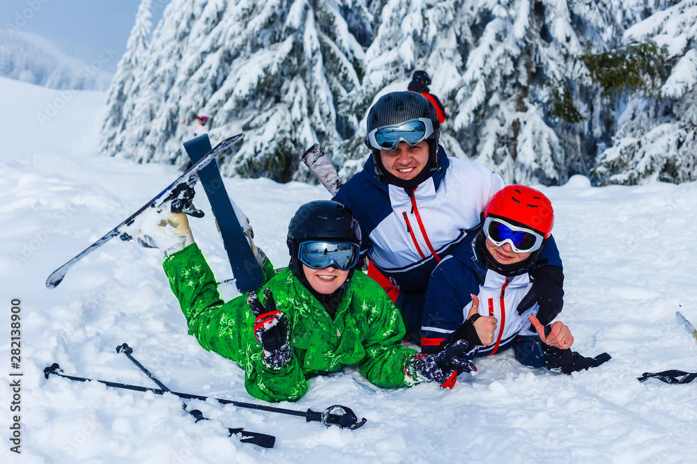 Group of friends with ski on winter holidays - Skiers having fun on the snow Group of friends with ski on winter holidays - Skiers having fun on the snow
