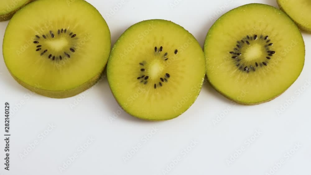 Kiwi Fruit Slices Rotating on white background Kiwi Fruit Slices Rotating on white background