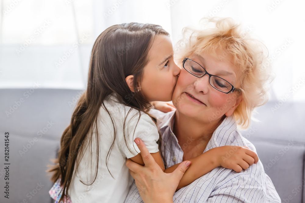 grandmother and granddaughter, celebrating mothers day or 8 march concept grandmother and granddaughter, celebrating mothers day or 8 march concept