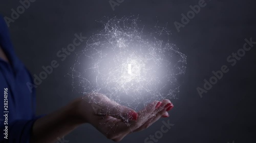 Hackhaton. Futuristic glowing hologram is over the palm and hand of woman. Technology connectivity concept. Shot on RED film camera.