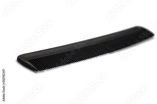 black comb isolated on white background. the concept of beauty