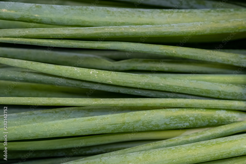 Green onion counter in a shop, green onions in a supermarket. Green onion counter in a shop, green onions in a supermarket.
