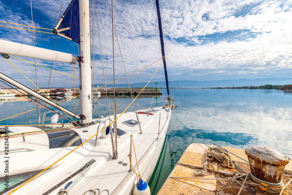 Obraz premium View on port with detail of docked sailboat in Privlaka village in the Zadar County of Croatia, Europe.