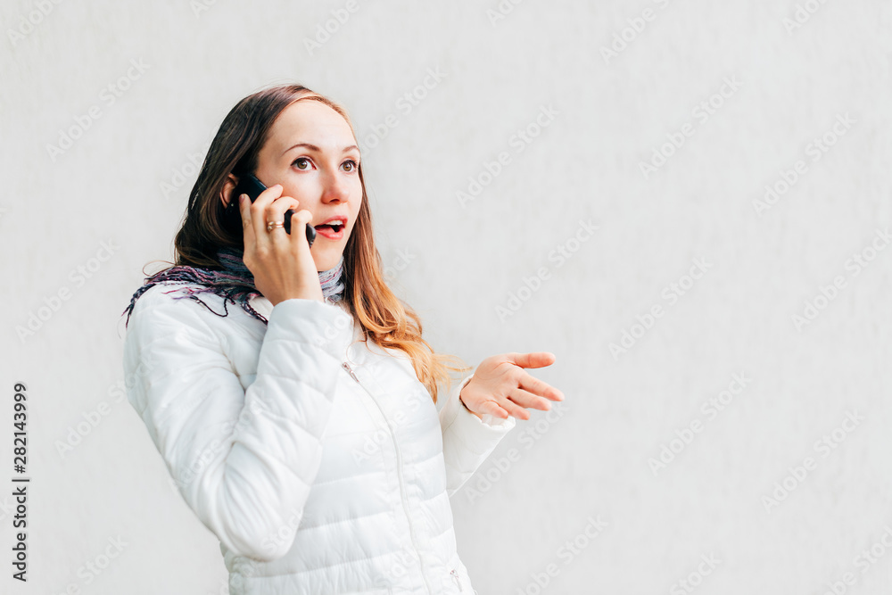 Portrait headshot of young Caucasian woman enthusiastically gesticulate arguing on mobile phone. Portrait headshot of young Caucasian woman enthusiastically gesticulate arguing on mobile phone.