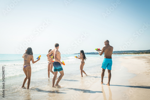 Friends having fun on the beach