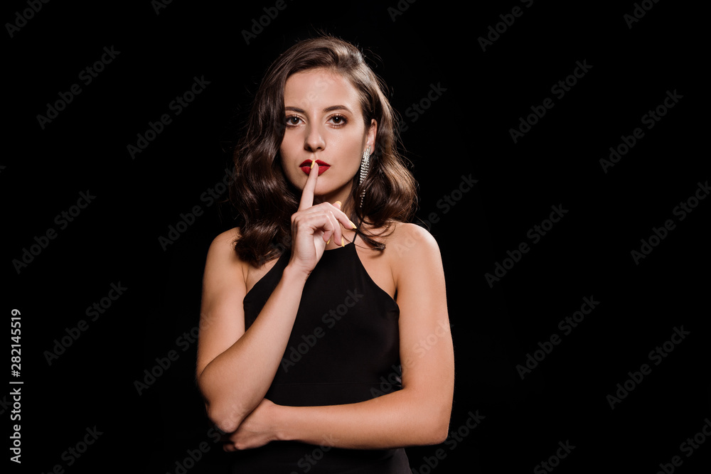 attractive and elegant woman showing hush sign isolated on black attractive and elegant woman showing hush sign isolated on black