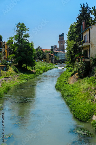 Padova, Italy - Jujy, 4, 2019: embankment of a channel in Padova, Italy photo