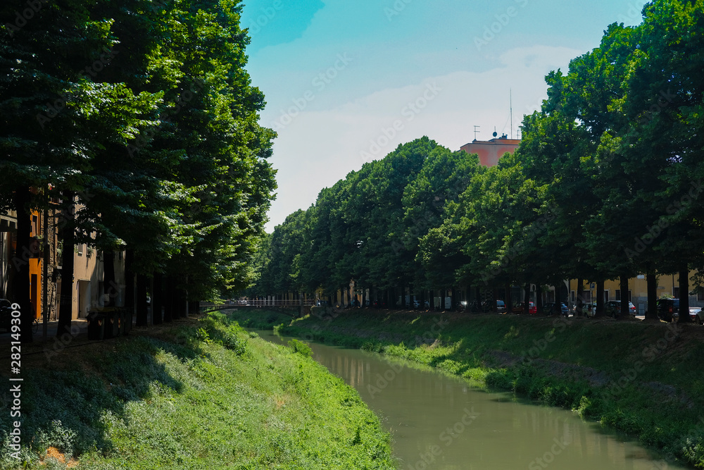 Padova, Italy - Jujy, 4, 2019: embankment of a channel in Padova, Italy