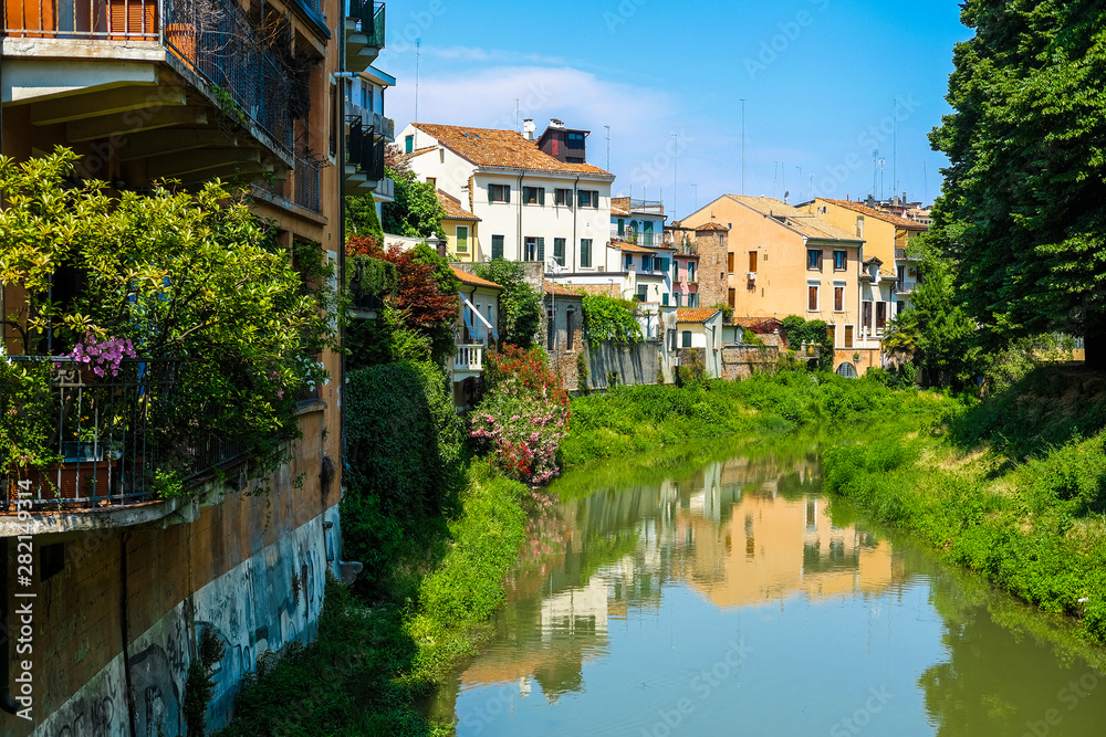 Padova, Italy - Jujy, 4, 2019: embankment of a channel in Padova, Italy