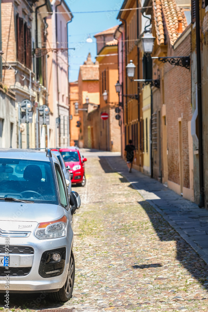 Ferrara, Italy - July, 11, 2019: cars on a parking in a center of Ferrara, Italy