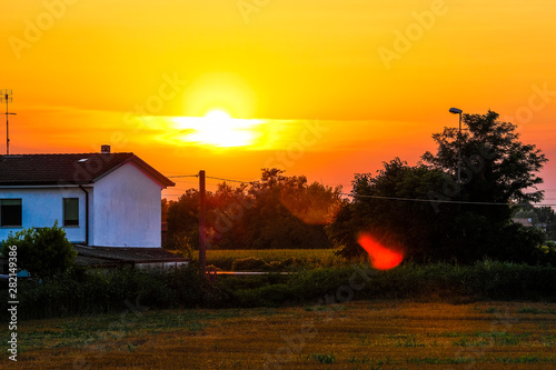 Landscape with the image of sunset in italian countryside photo