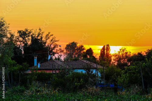 Landscape with the image of sunset in italian countryside photo