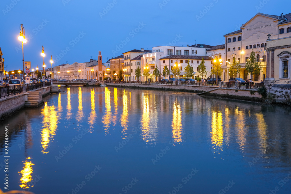 Adria, Italy - July, 07, 2019: cityscape with the image of channel in Adria, Italy in the evening
