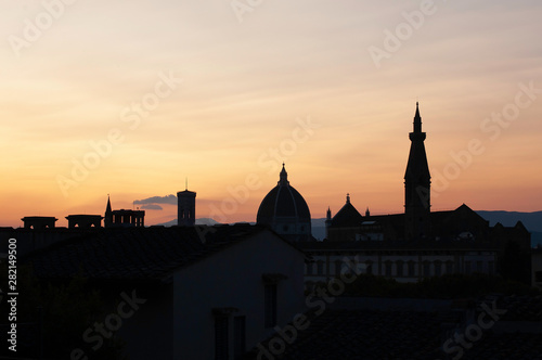 Sihouettes of landmarks from hill near at sunset in Florence, Italy. Santa Maria del Fiore in the evening
