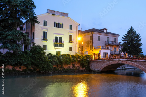 Adria, Italy - July, 07, 2019: cityscape with the image of channel in Adria, Italy in the evening © Dmitry Vereshchagin