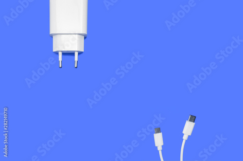 deconstructed charger on blue background - USB type c and micro b cable