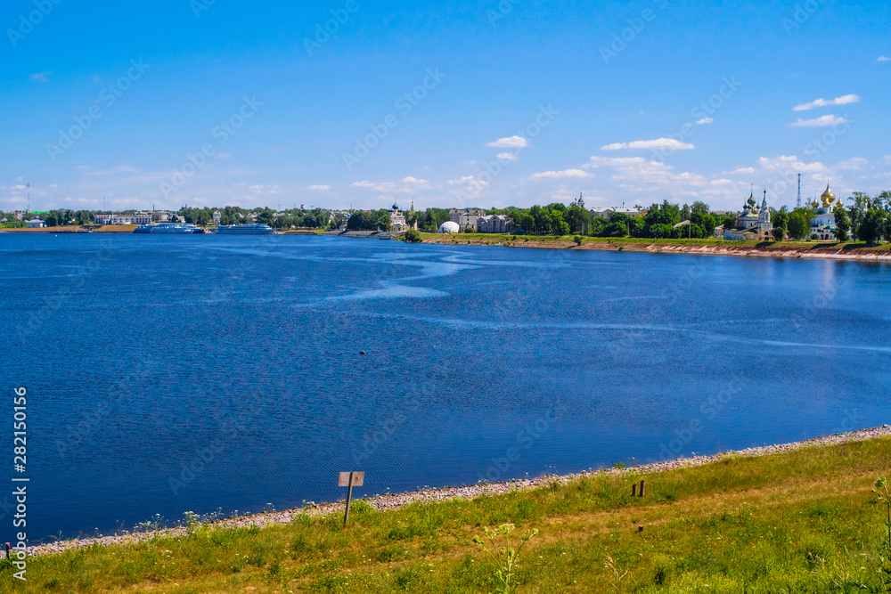 Uglich, Russia - June, 17, 2019: embankment of Volga river in Uglich, Russia with a view to .Kremlin and resurrection monastery