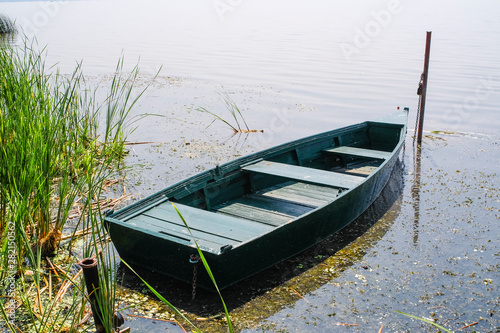 an image of a boat tied at the riverbank