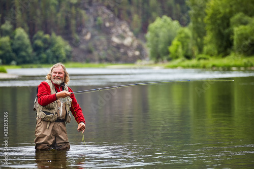 Flyfishing in river during eco-tourism.