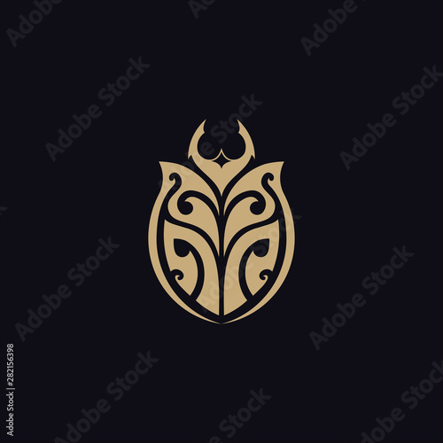 beetle with tribal tattoo logo vector design template