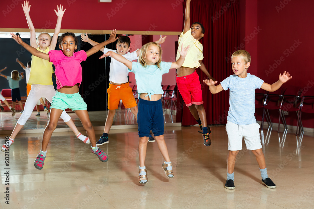 Little boys and girls jumping and having dancing class