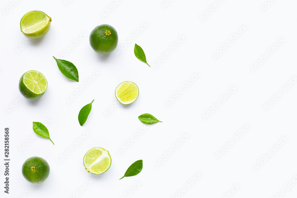 Limes with leaves isolated on white background. Limes with leaves isolated on white background.
