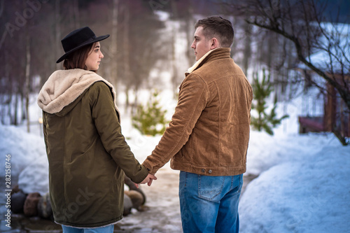 A man and a woman look at e...