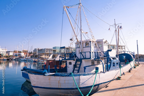 Republic of Cyprus. The Seafront Of Limassol. Boats at the pier. Boat trips in the Mediterranean sea. Fishing. View of Limassol on a summer day. Travelling to Cyprus.