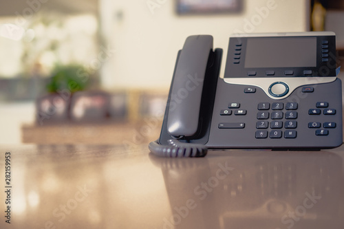 Close up soft focus on ip phone devices at office desk,Cocept business work.