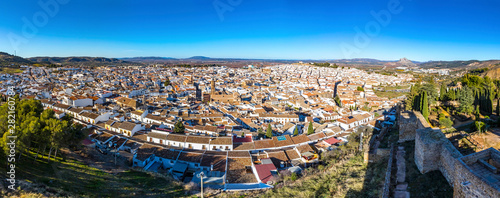 Panoramic aerial skyline view of Antequera city, province of Malaga, Andalusia, Spain. Famous tourist and cultural center. Mountain Pena de los Enamorados (The Lovers Rock) on the right on background