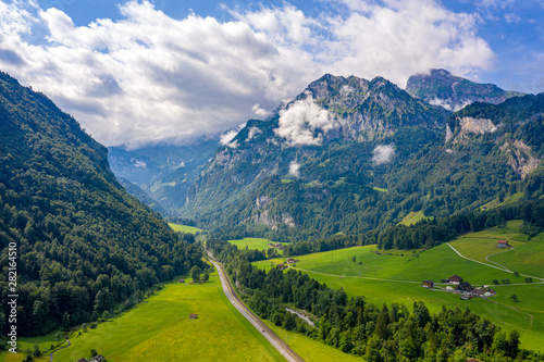 Wonderful aerial view over a valley in the Swiss Alps - Switzerland from above © 4kclips
