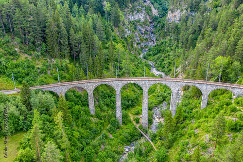 Famous viaduct near Filisur in the Swiss Alps called Landwasser Viaduct - Switzerland from above