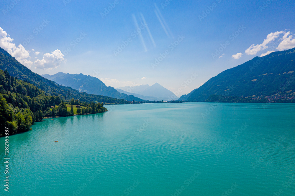 Obraz premium The turquoise water of a wonderful lake in Switzerland - aerial view
