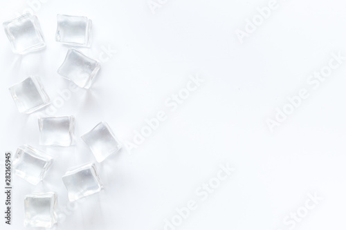 ice cubes on white table top view mock up