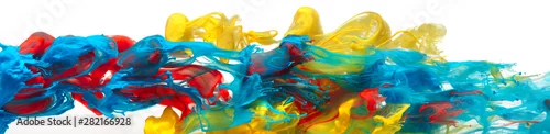 Panel kuchenny z motywem Red, yellow, and blue paints and inks swirling together in water abstract background
