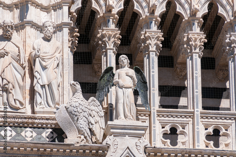 Close up of architectural details on facade of Siena cathedral
