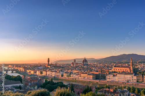Cathedral of Santa Maria del Fiore and Florence rooftops with mountains © Olga K