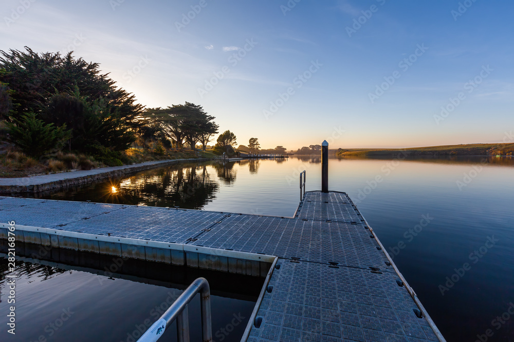 Pier on a river at sunrise with copy space. Allansford, Victoria, Australia