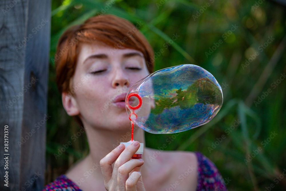 WOMAN SITTING ON A GANGWAY WITH BUBBLES. WOMAN SITTING ON A GANGWAY WITH BUBBLES.