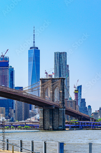 Brooklyn Bridge with lower Manhattan skyline, One World Trade Center in New York City. © Vadim
