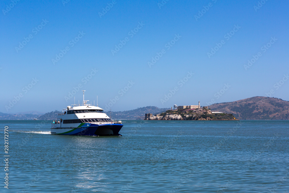Tourist ship and Alcatraz Island in San Francisco, USA.
