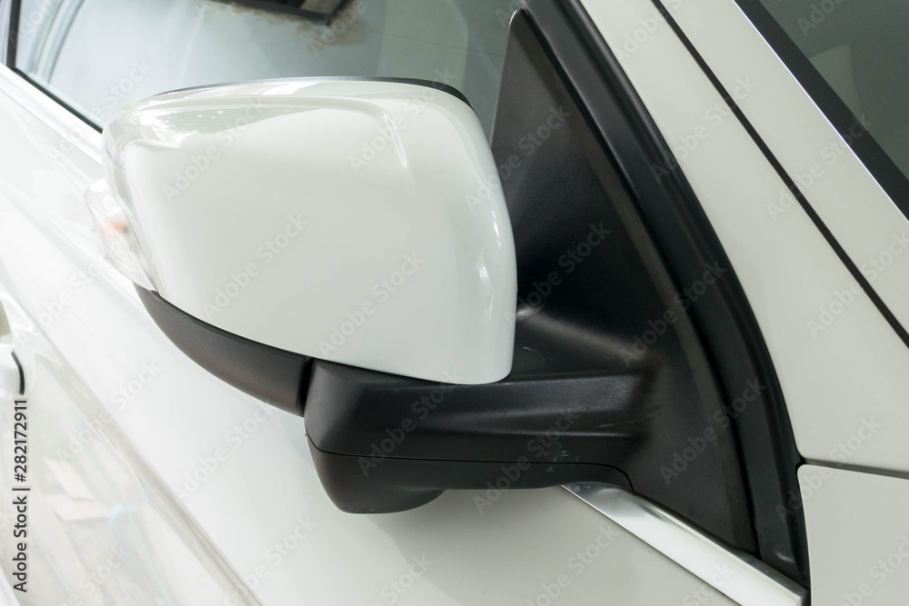 Luxury white car folded side mirror. Luxury white car folded side mirror.