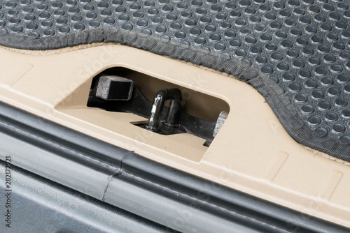 Luxury car trunk boot lock brace close up. © Photo Builder