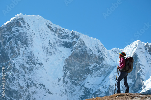 Hiker on the top in Himalayas mountains. Nepal, Everest region