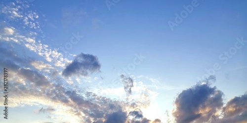 blue sky with clouds and sun