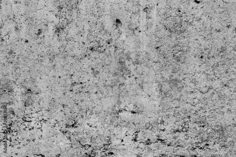 Texture of a concrete wall with cracks and scratches which can be used as a background