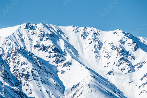 mountains in winter, snow capped peaks, mountain winter landscape